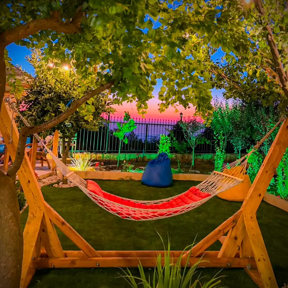 Hammock over the valley at sunset